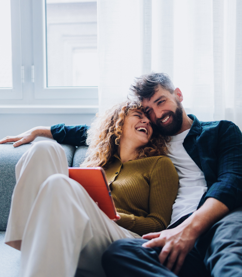 Young couple assessing affordability with broker
