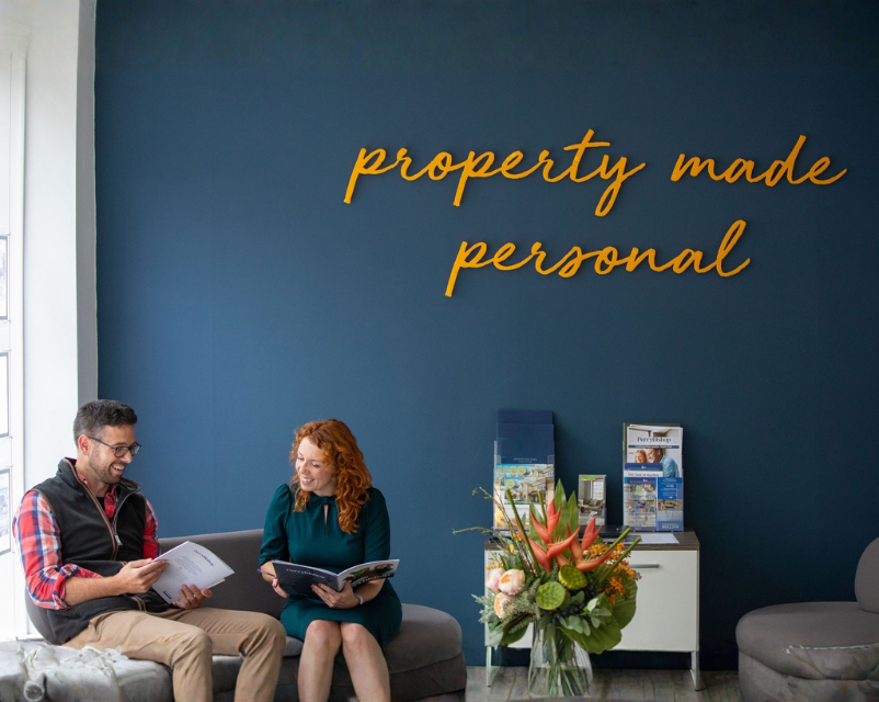 Property investor meeting letting specialist at office